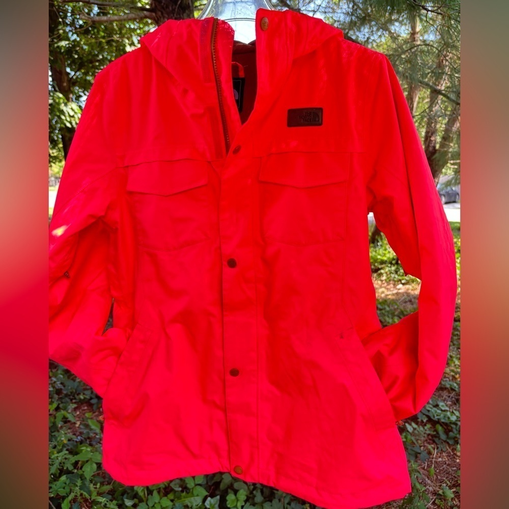 The Northface women’s hooded hyvent neon orange jacket